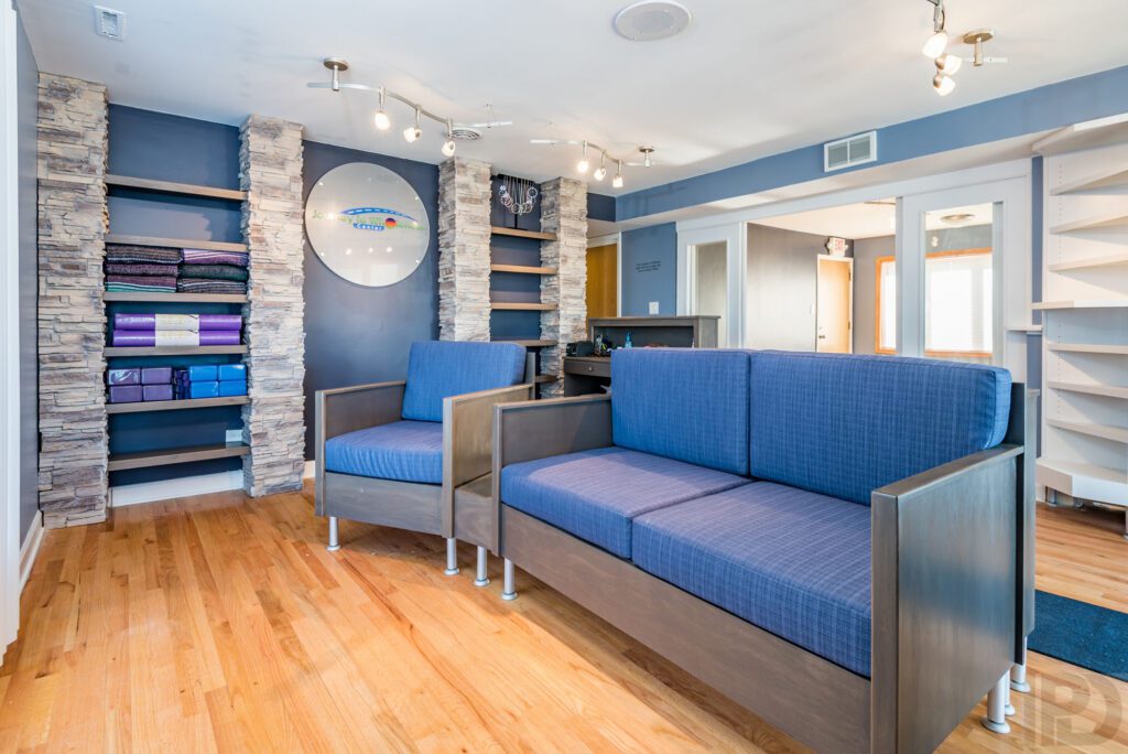 Blue couches and wall paint in a waiting area of a commercial property