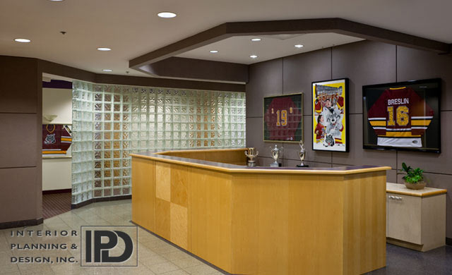 The lobby counter with three trophies on top