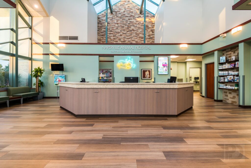 A Reception Desk Area With Wood Flooring