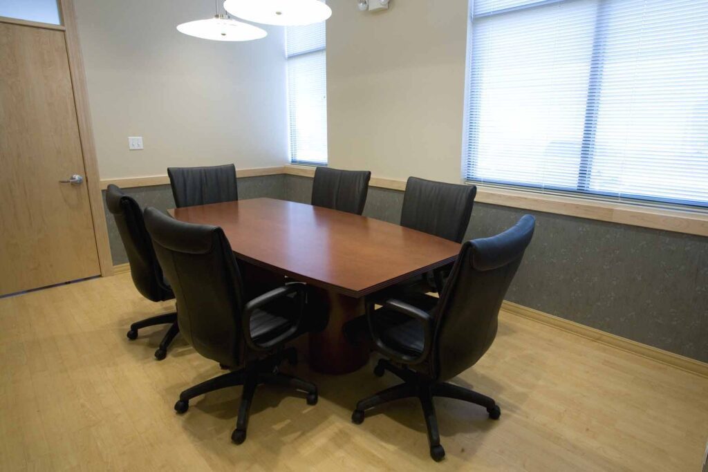 A conference room with black chairs