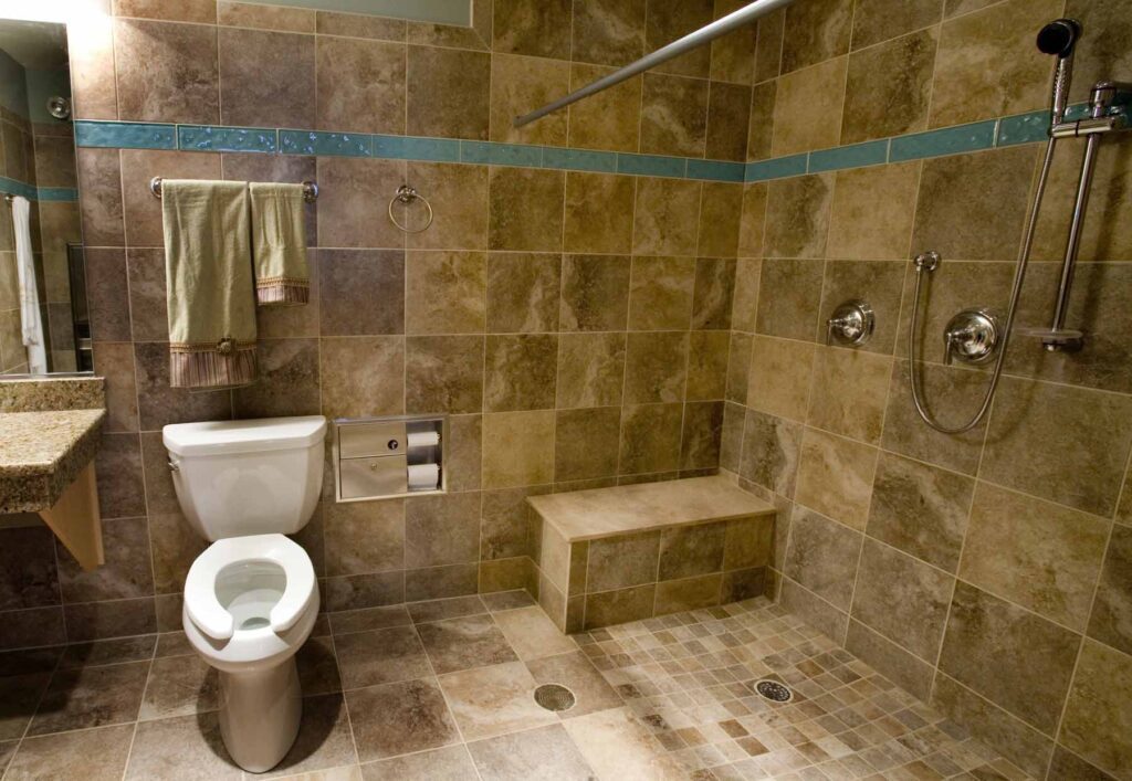 A bathroom with brown tiles