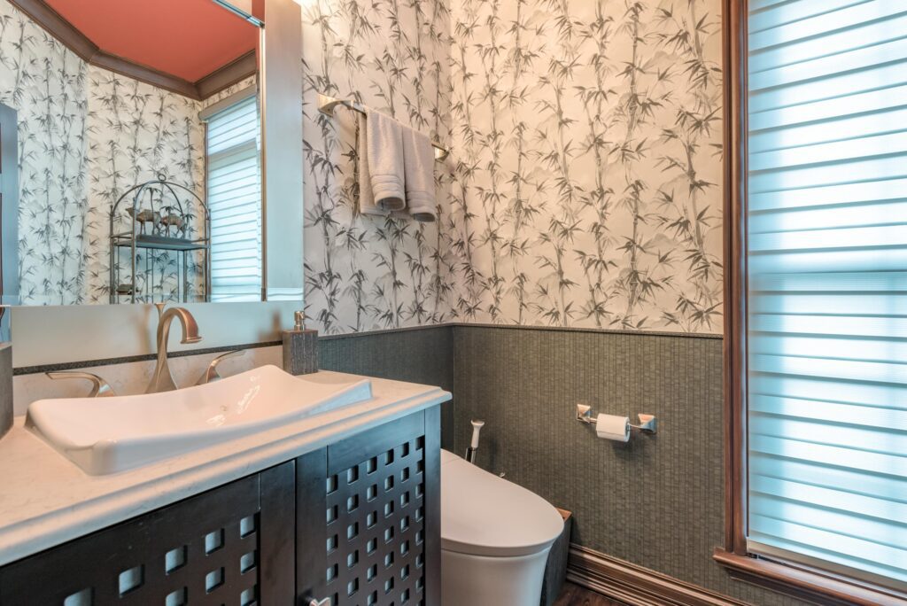 A bathroom with white and gray walls