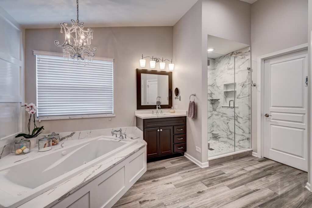 A bathroom area with white, gray, and dark brown interior